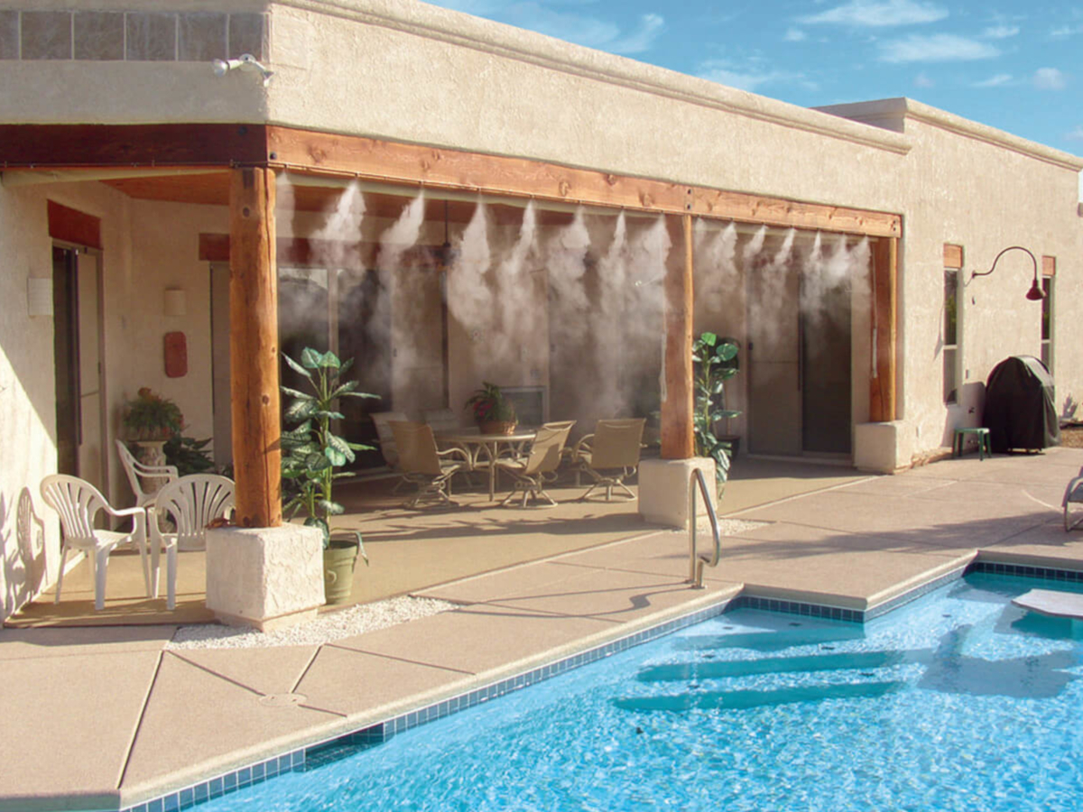 misting system in backyard by pool