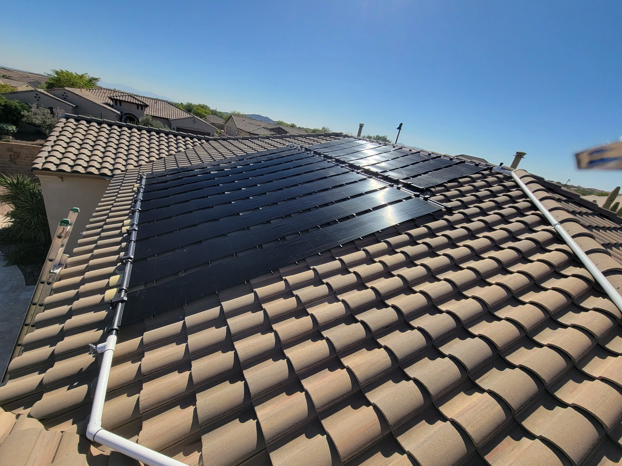 Sunsplash solar pool heating panel on roof
