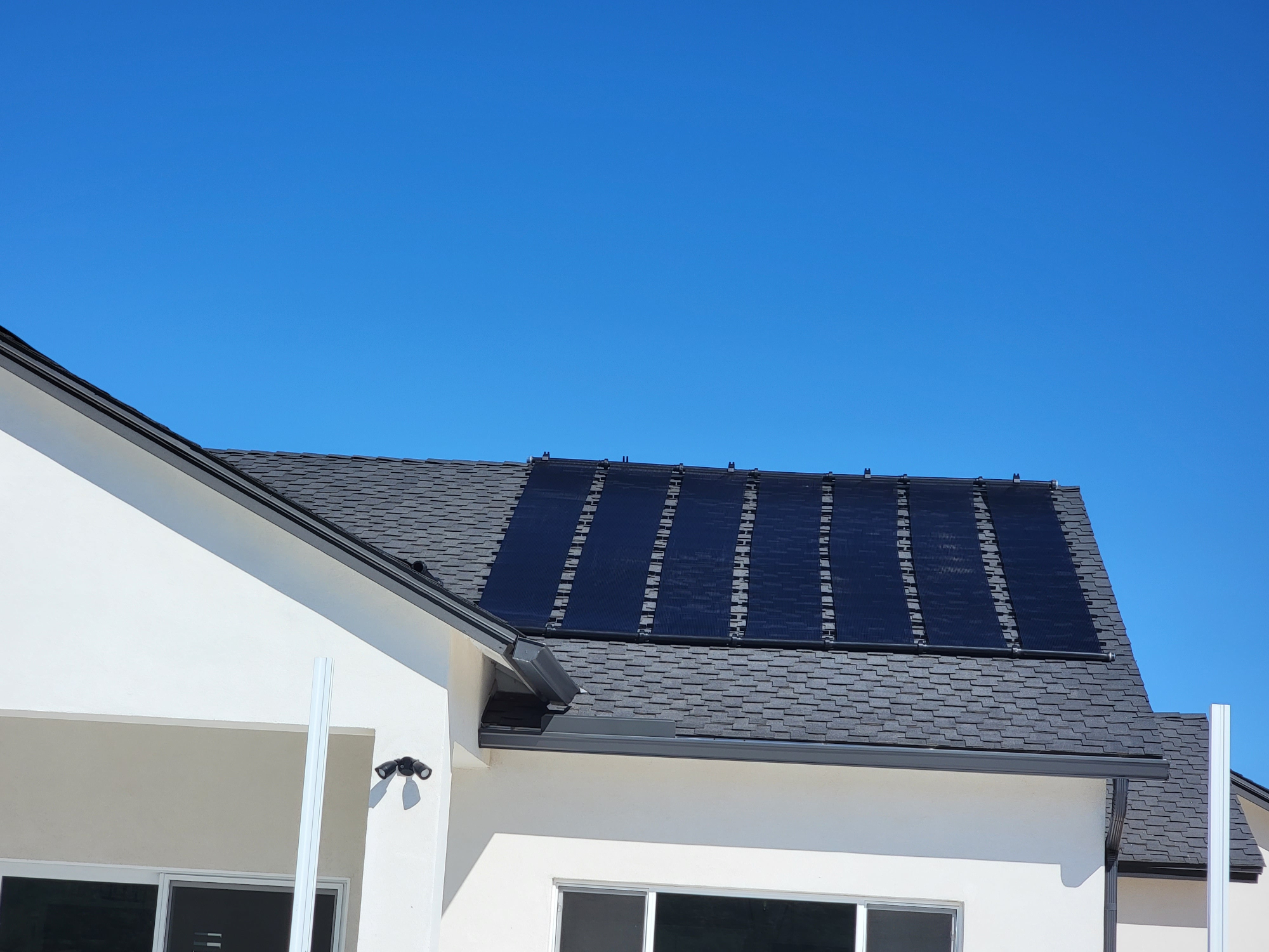 solar pool heating on roof of house